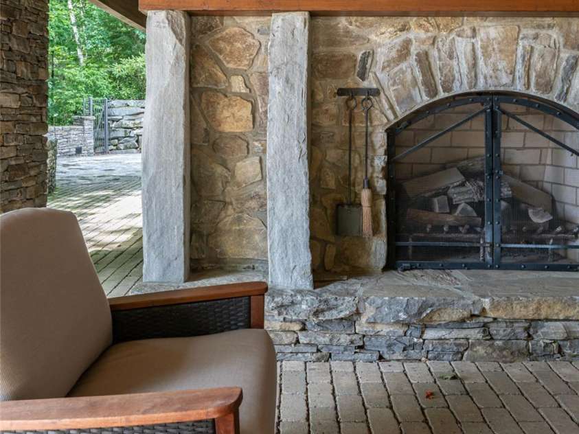 4900 Preserve Road, Sylva, NC 28779.  MLS# CAR4393548, YatesRealty ID 36172. Outdoor wood burning fireplace
