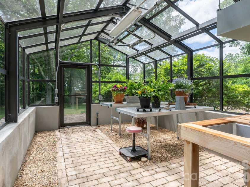 4900 Preserve Road, Sylva, NC 28779.  MLS# CAR4393548, YatesRealty ID 36172. Professional greenhouse fit for a true gardener or aspirant