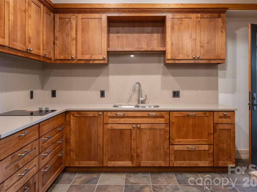 4900 Preserve Road, Sylva, NC 28779.  MLS# CAR4393548, YatesRealty ID 36172. Second kitchen in lower level recently finished by clark and leatherwood