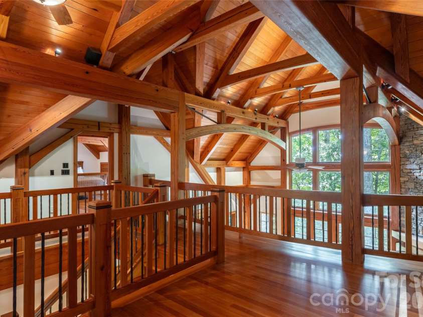 4900 Preserve Road, Sylva, NC 28779.  MLS# CAR4393548, YatesRealty ID 36172. Spacious upper level loft with it's striking timber scene