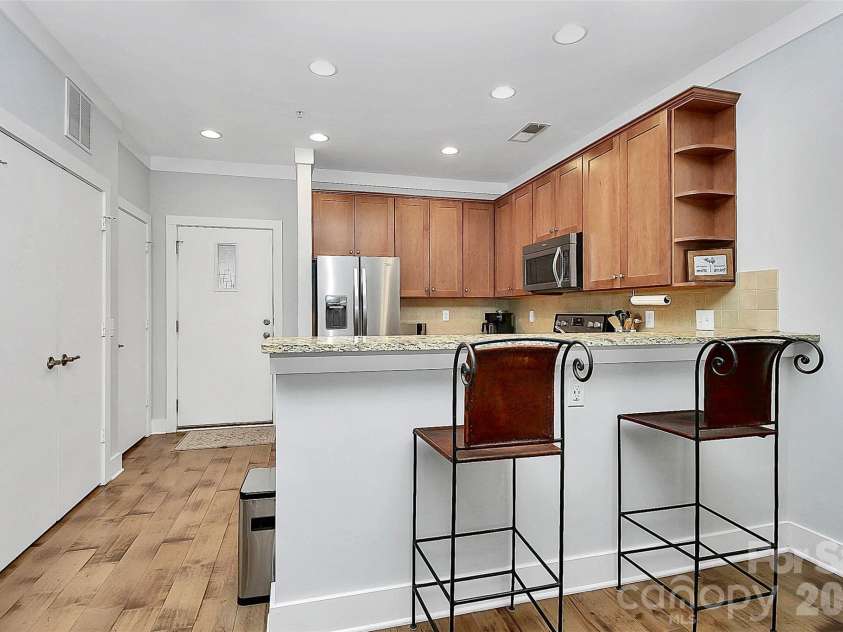 748 Cotton Gin Alley, Davidson, NC 28036.  MLS# CAR4402727, YatesRealty ID 36173. Bar counter at kitchen.