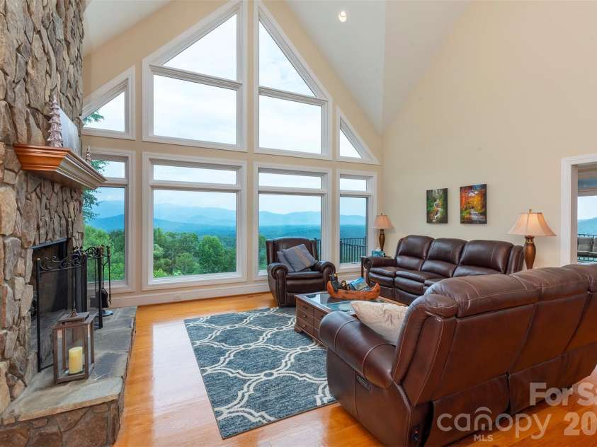 301 Oak Winds Drive, Old Fort, NC 28762.  MLS# CAR4399378, YatesRealty ID 36175. Large vaulted ceiling living room