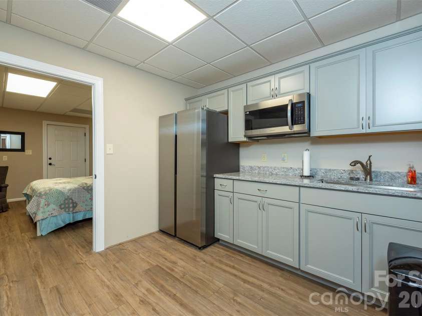 301 Oak Winds Drive, Old Fort, NC 28762.  MLS# CAR4399378, YatesRealty ID 36175. Lower level kitchenette