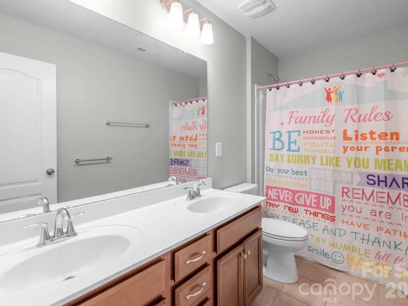 17713 Yarwill Court, Charlotte, NC 28278.  MLS# CAR4400457, YatesRealty ID 36179. Hall bathroom