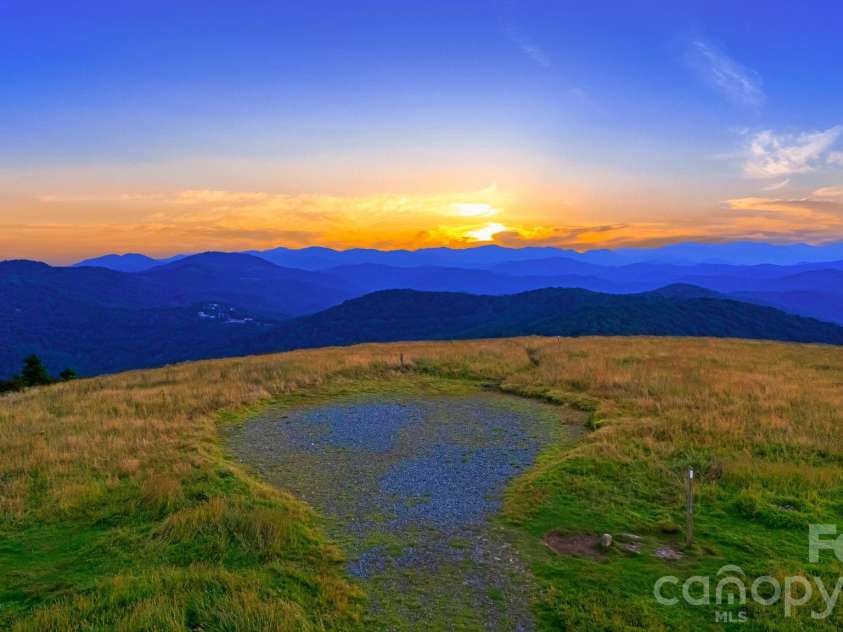 46 Trillium Lane, Mars Hill, NC 28754.  MLS# CAR4399565, YatesRealty ID 36188. Big Bald sunsets