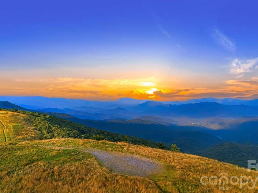 46 Trillium Lane, Mars Hill, NC 28754.  MLS# CAR4399565, YatesRealty ID 36188. Big Bald sunsets.