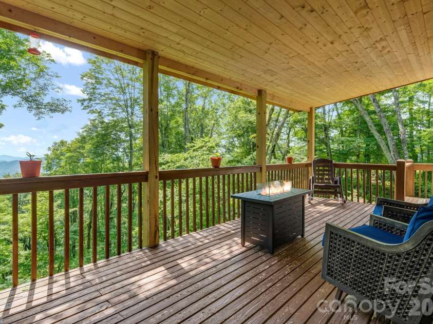 46 Trillium Lane, Mars Hill, NC 28754.  MLS# CAR4399565, YatesRealty ID 36188. Main level covered deck overlooking the year round mountain views.