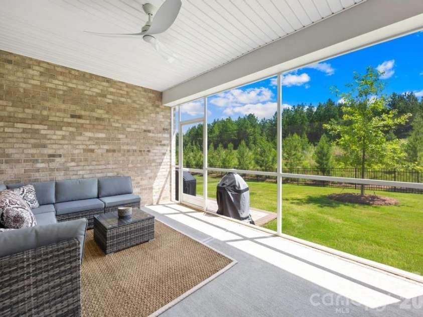 9612 Liberty Hill Drive, Mint Hill, NC 28227.  MLS# CAR4398722, YatesRealty ID 36215. Screened back porch. Sellers added BBQ patio in backyard with pavers and fenced backyard