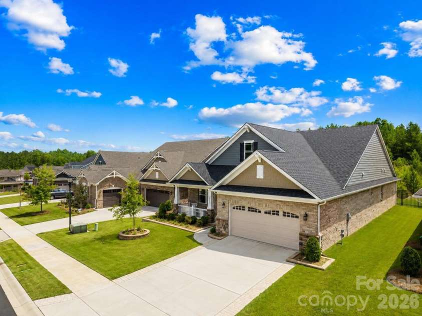 9612 Liberty Hill Drive, Mint Hill, NC 28227.  MLS# CAR4398722, YatesRealty ID 36215. Sellers expanded driveway with pavers and added elegant stone planters in front of home