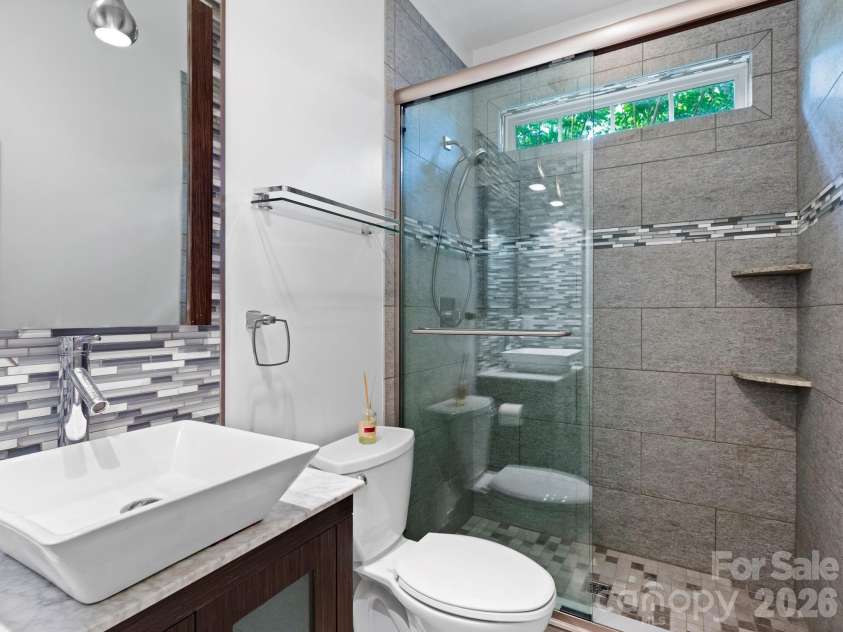 412 Silo Drive, Asheville, NC 28806.  MLS# CAR4399227, YatesRealty ID 36220. Full bathroom with custom tilework.
