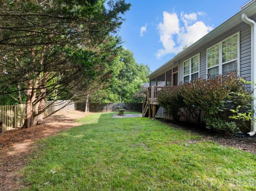 412 Silo Drive, Asheville, NC 28806.  MLS# CAR4399227, YatesRealty ID 36220. Lush and level back yard.