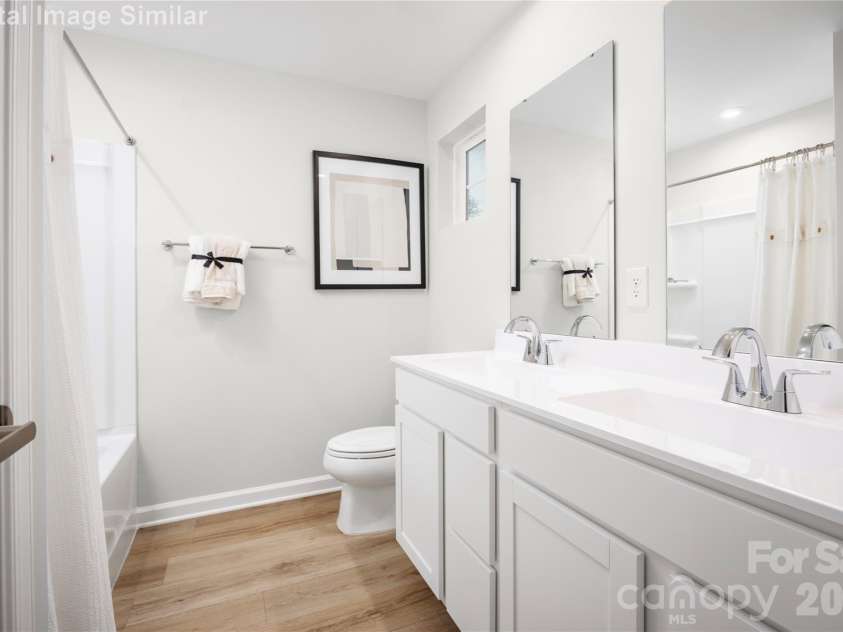 6148 Bridle Creek Drive, Charlotte, NC 28214.  MLS# CAR4401807, YatesRealty ID 36229. Relax and recharge in this spa-inspired owner’s bath—featuring dual ceramic sinks, generous space, and thoughtful storage for everyday luxury.