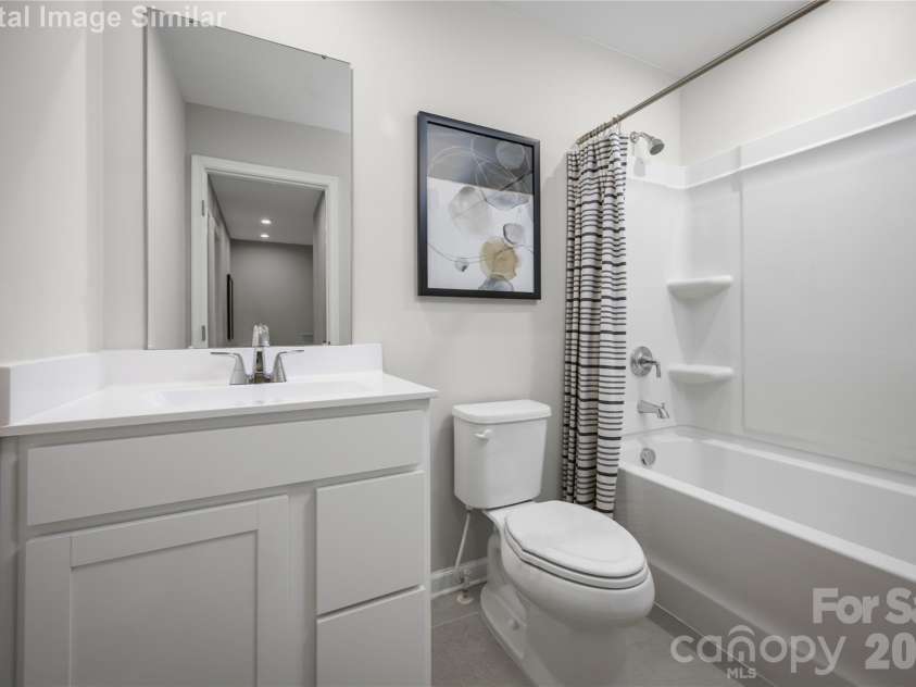 6148 Bridle Creek Drive, Charlotte, NC 28214.  MLS# CAR4401807, YatesRealty ID 36229. Stylish and practical—this shared guest bath offers sleek finishes and everyday comfort for effortless living.