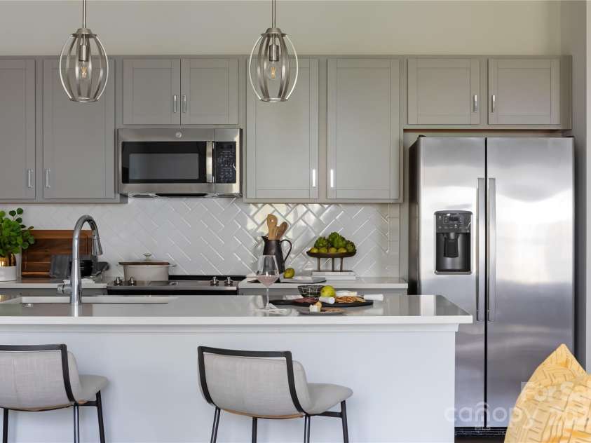 4114 Lattistep Lane, Charlotte, NC 28269.  MLS# CAR4220690, YatesRealty ID 3623. The Conrad Model | Context at Oakhurst *actual finishes, color scheme, orientation vary on this home. Furniture not included