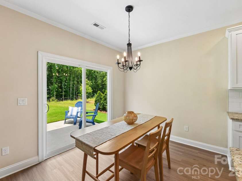 148 Tanner Loop, Troutman, NC 28166.  MLS# CAR4401637, YatesRealty ID 36232. Breakfast nook overlooking patio.