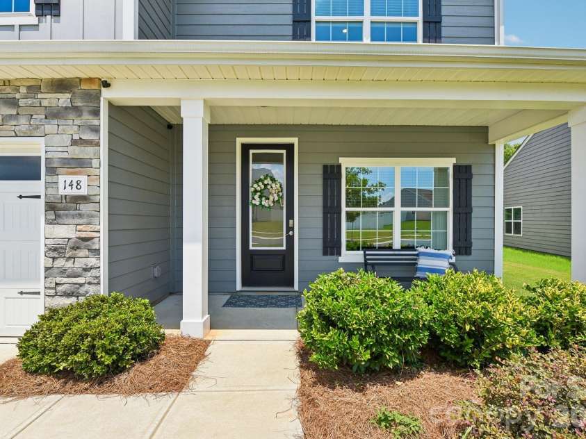 148 Tanner Loop, Troutman, NC 28166.  MLS# CAR4401637, YatesRealty ID 36232. Covered front porch