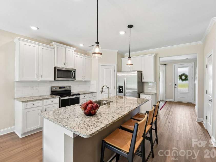 148 Tanner Loop, Troutman, NC 28166.  MLS# CAR4401637, YatesRealty ID 36232. Island / breakfast bar
