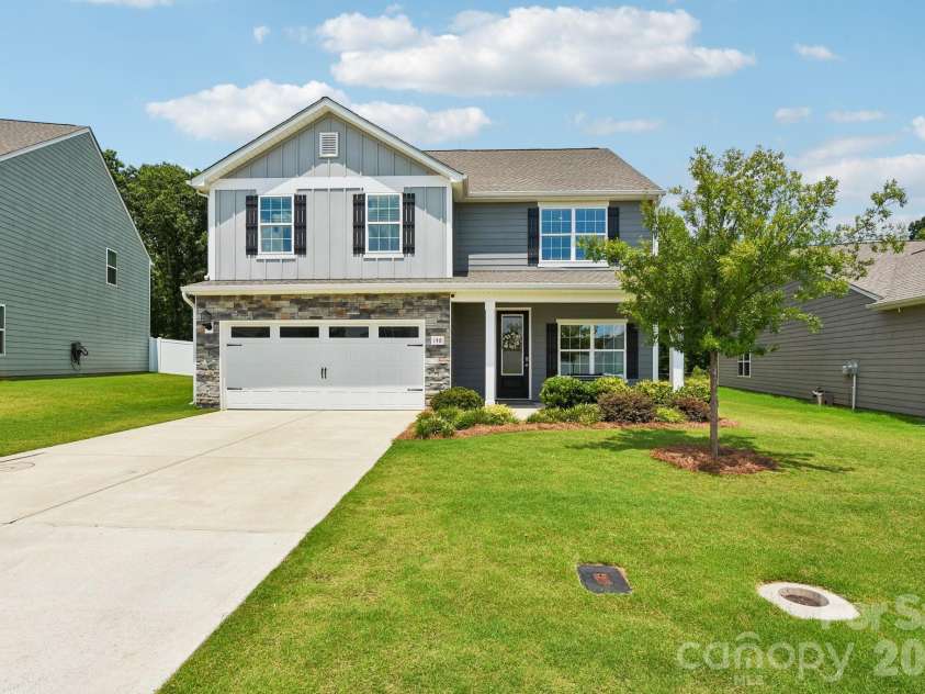 148 Tanner Loop, Troutman, NC 28166.  MLS# CAR4401637, YatesRealty ID 36232. Long drive provides extra parking space.