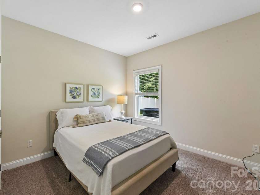 148 Tanner Loop, Troutman, NC 28166.  MLS# CAR4401637, YatesRealty ID 36232. Main floor guest bedroom