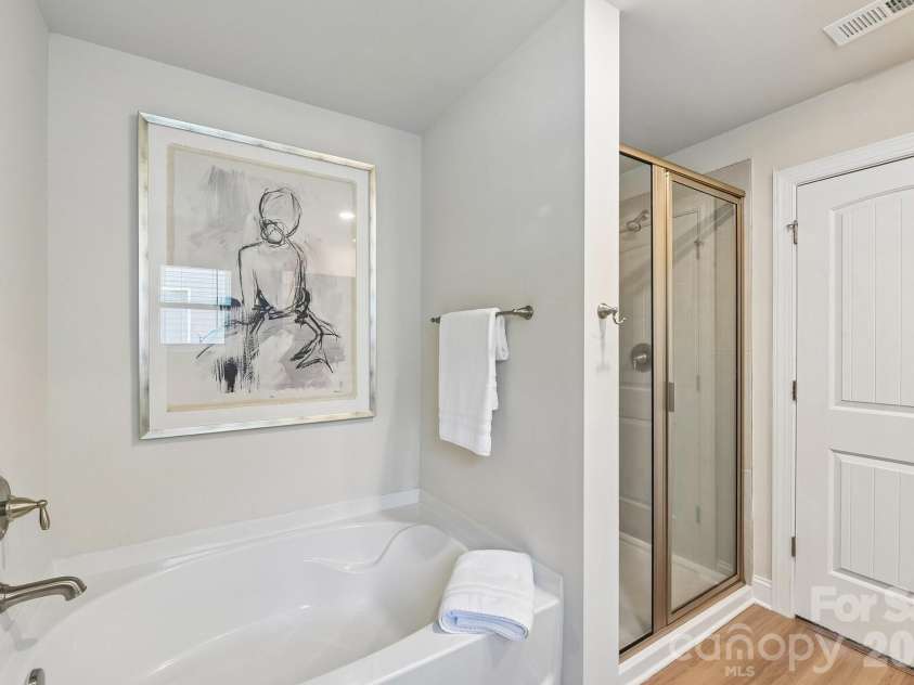 148 Tanner Loop, Troutman, NC 28166.  MLS# CAR4401637, YatesRealty ID 36232. Primary has soaking tub and separate shower