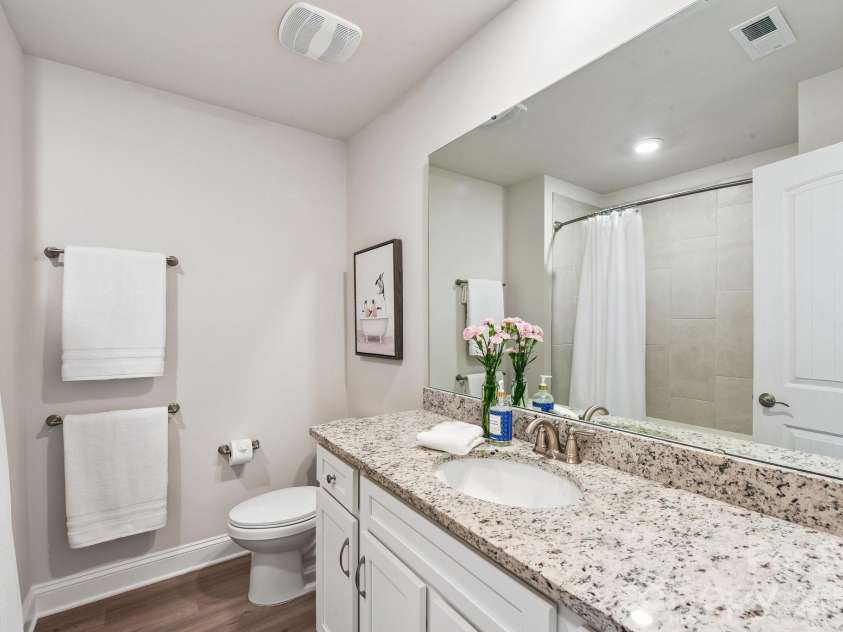 148 Tanner Loop, Troutman, NC 28166.  MLS# CAR4401637, YatesRealty ID 36232. Upstairs hall bathroom