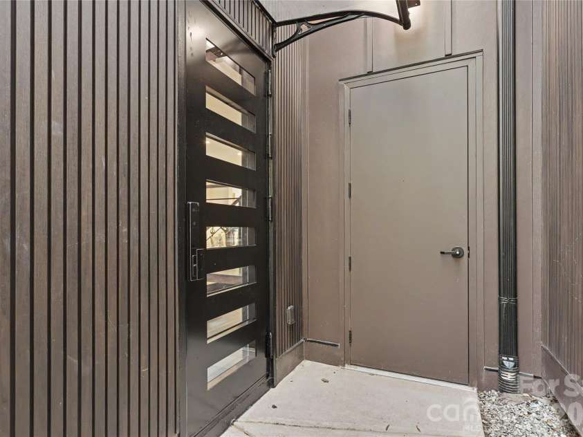 5447 Topping Place, Charlotte, NC 28209.  MLS# CAR4429089, YatesRealty ID 36246. Side door and storage closet