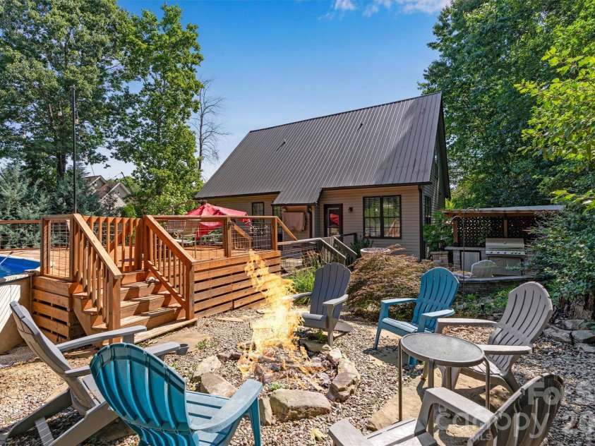 1915 Lynmore Drive, Sherrills Ford, NC 28673.  MLS# CAR4397837, YatesRealty ID 36252. Backyard firepit/pool/ tiki area