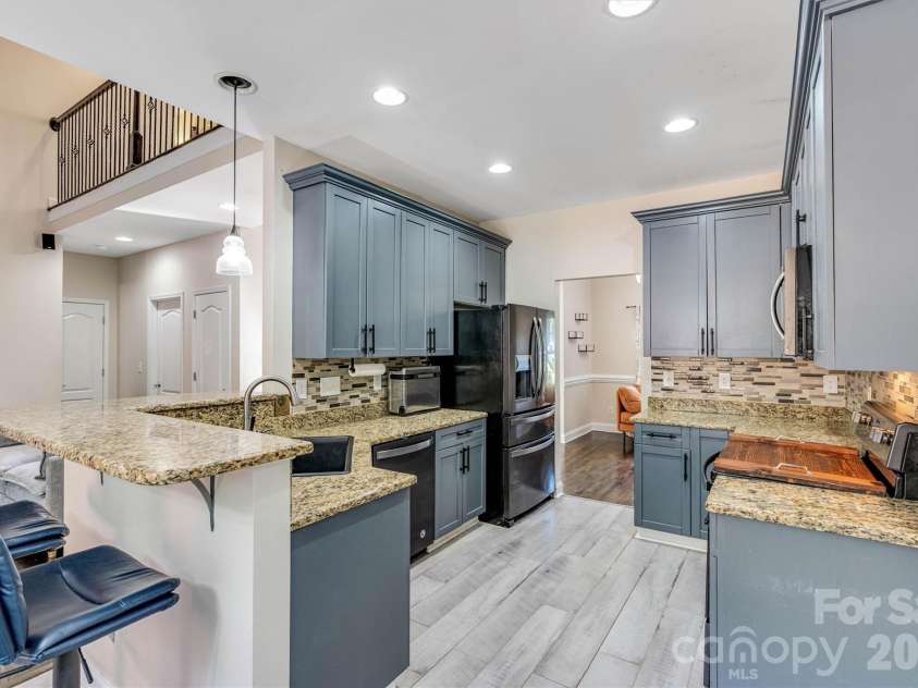 1915 Lynmore Drive, Sherrills Ford, NC 28673.  MLS# CAR4397837, YatesRealty ID 36252. Kitchen with bar seating