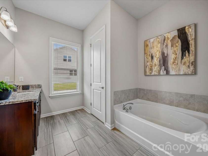 1427 Brooksland Place, Waxhaw, NC 28173.  MLS# CAR4398529, YatesRealty ID 36268. Primary bathroom
