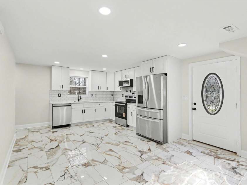 1308 Redland Drive, Gastonia, NC 28054.  MLS# CAR4340015, YatesRealty ID 3627. BASEMENT KITCHEN