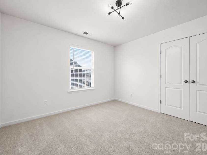 2617 Kinmere Drive, Gastonia, NC 28056.  MLS# CAR4358235, YatesRealty ID 36275. 2nd floor bedroom with updated lighting