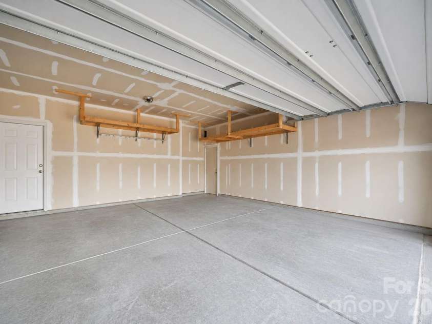2617 Kinmere Drive, Gastonia, NC 28056.  MLS# CAR4358235, YatesRealty ID 36275. Built in shelving throughout garage