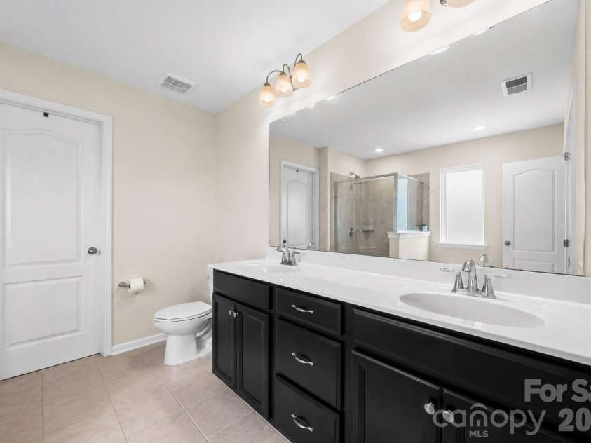 2617 Kinmere Drive, Gastonia, NC 28056.  MLS# CAR4358235, YatesRealty ID 36275. Primary bathroom with dual vanities