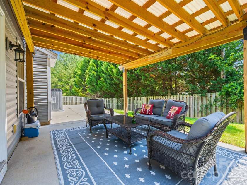 7076 White Bluff Drive, Tega Cay, SC 29708.  MLS# CAR4400835, YatesRealty ID 36276. Pergola / back patio