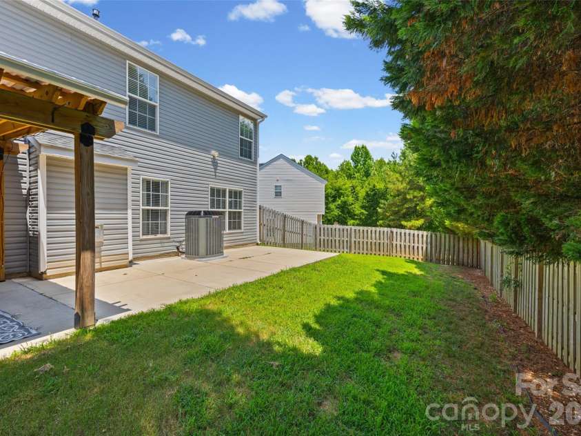 7076 White Bluff Drive, Tega Cay, SC 29708.  MLS# CAR4400835, YatesRealty ID 36276. Private backyard