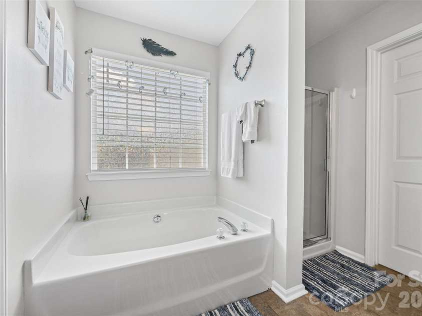 7076 White Bluff Drive, Tega Cay, SC 29708.  MLS# CAR4400835, YatesRealty ID 36276. Soaking tub/ separate shower