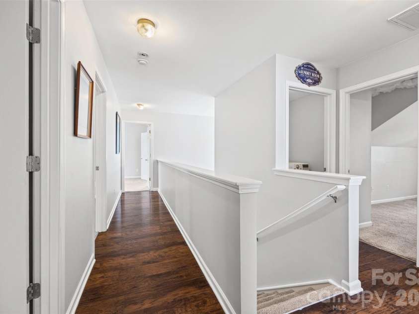 7076 White Bluff Drive, Tega Cay, SC 29708.  MLS# CAR4400835, YatesRealty ID 36276. Upstairs hallway