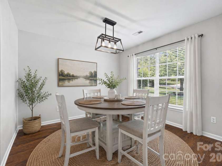 7076 White Bluff Drive, Tega Cay, SC 29708.  MLS# CAR4400835, YatesRealty ID 36276. Virtually staged dining room
