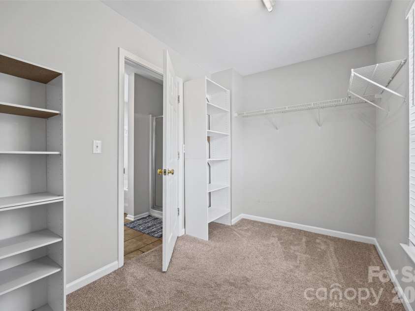 7076 White Bluff Drive, Tega Cay, SC 29708.  MLS# CAR4400835, YatesRealty ID 36276. Walk-in primary bedroom closet