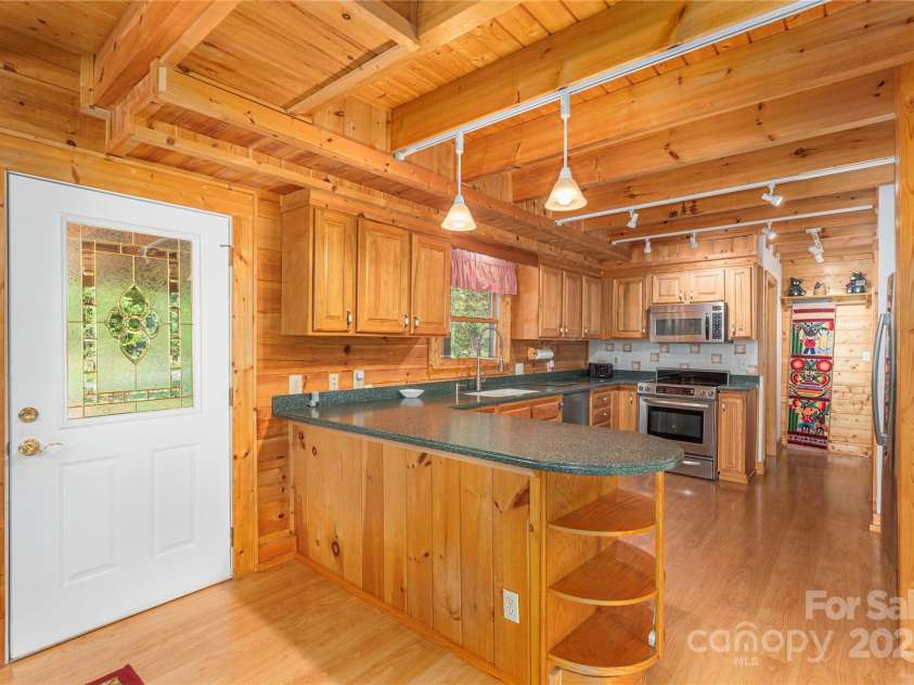 235 Timucua Trail, Waynesville, NC 28786.  MLS# CAR4301389, YatesRealty ID 3628. Solid surface counters, breakfast bar.