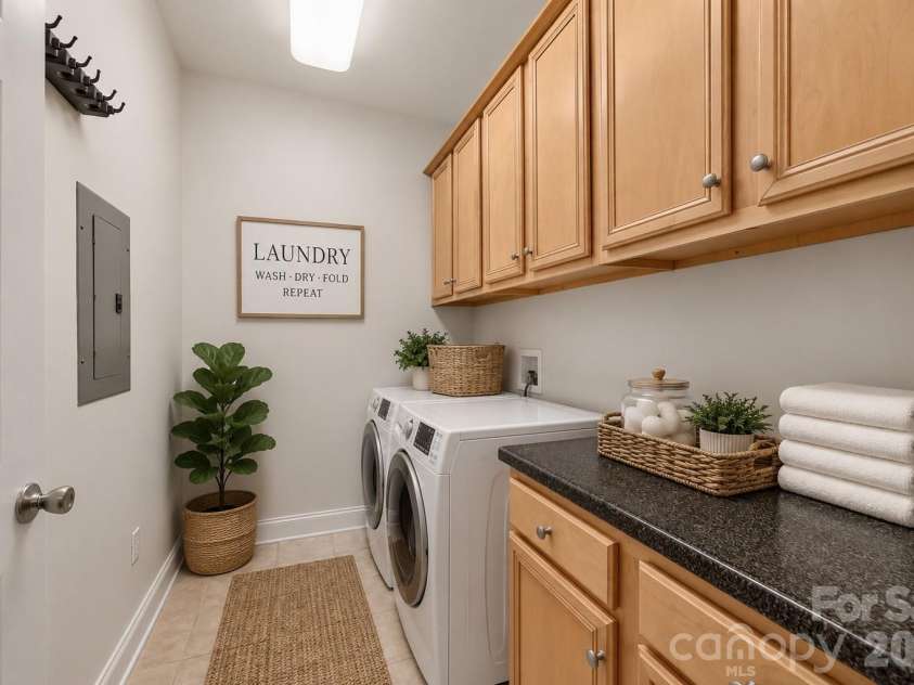 8955 Rosalyn Glen Road, Cornelius, NC 28031.  MLS# CAR4396668, YatesRealty ID 36286. Dedicated Laundry room (staged - appliances do not convey)
