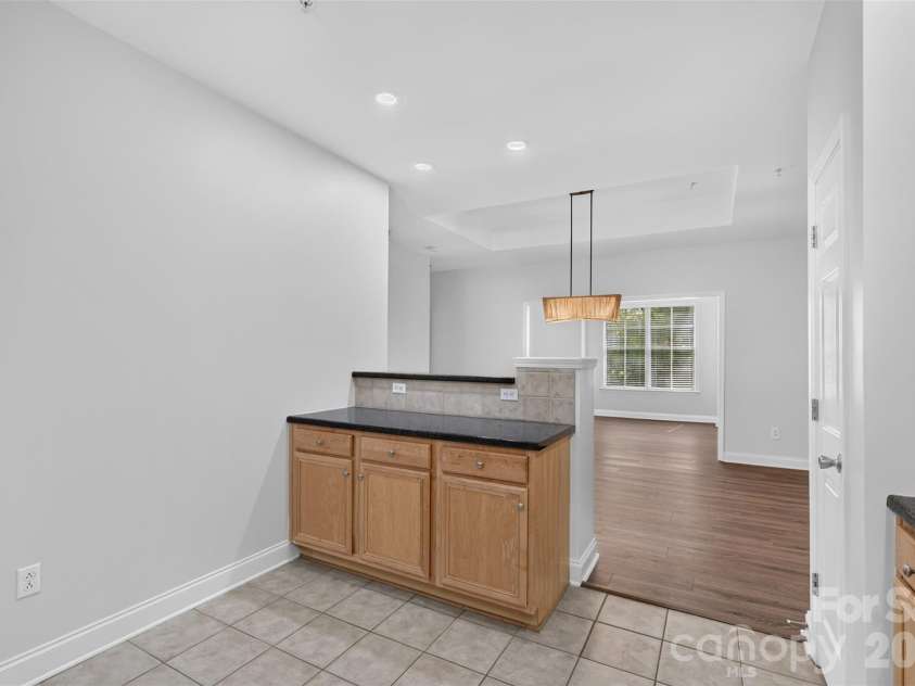 8955 Rosalyn Glen Road, Cornelius, NC 28031.  MLS# CAR4396668, YatesRealty ID 36286. Eat-at bar with storage