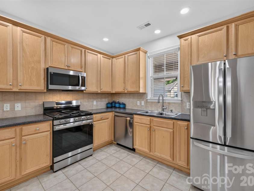 8955 Rosalyn Glen Road, Cornelius, NC 28031.  MLS# CAR4396668, YatesRealty ID 36286. Staged Bright Kitchen with Ample Cupboard Space