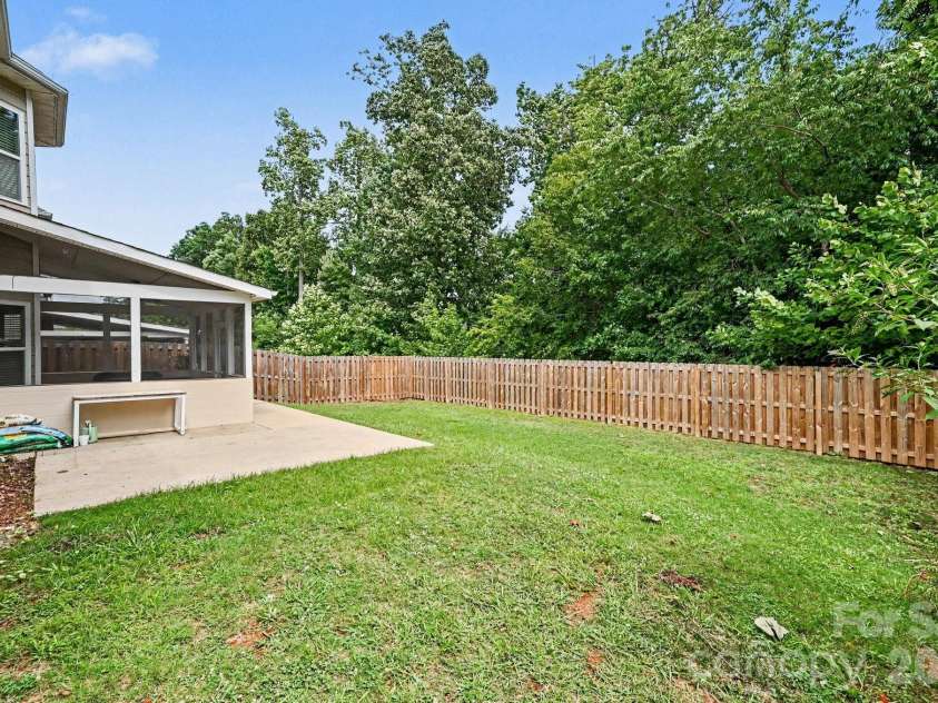 10202 Falling Leaf Drive, Concord, NC 28027.  MLS# CAR4396937, YatesRealty ID 36288. Private back yard