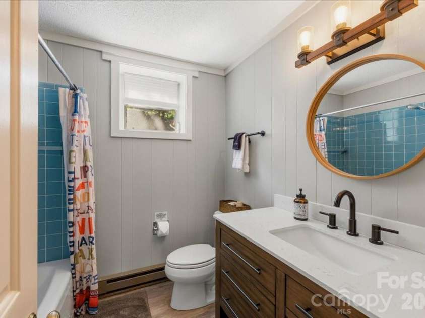 6149 Shore Drive, Nebo, NC 28761.  MLS# CAR4401444, YatesRealty ID 36297. Lower level bathroom