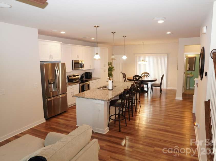 1028 Sharon Towns Drive, Charlotte, NC 28210.  MLS# CAR4212883, YatesRealty ID 363. Livingroom/kitchen