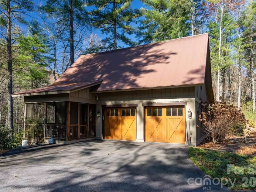 69 Dogwood Branch Lane, Zirconia, NC 28790.  MLS# CAR4310919, YatesRealty ID 363. Second Cabin with the two car garage extra lot behind the guest cabin.