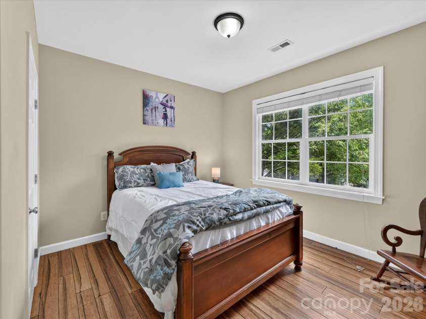 18625 The Commons Boulevard, Cornelius, NC 28031.  MLS# CAR4397710, YatesRealty ID 36310. Bedroom 3 is bright and inviting, offering generous natural light, a spacious closet, and a versatile layout ideal for family, guests, or a home office.