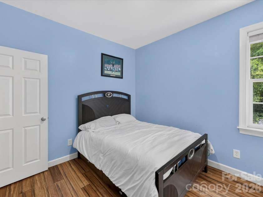 18625 The Commons Boulevard, Cornelius, NC 28031.  MLS# CAR4397710, YatesRealty ID 36310. Bedroom 4 is a comfortable secondary bedroom featuring abundant natural light, a spacious closet, and flexible space for family, guests, or a home office.