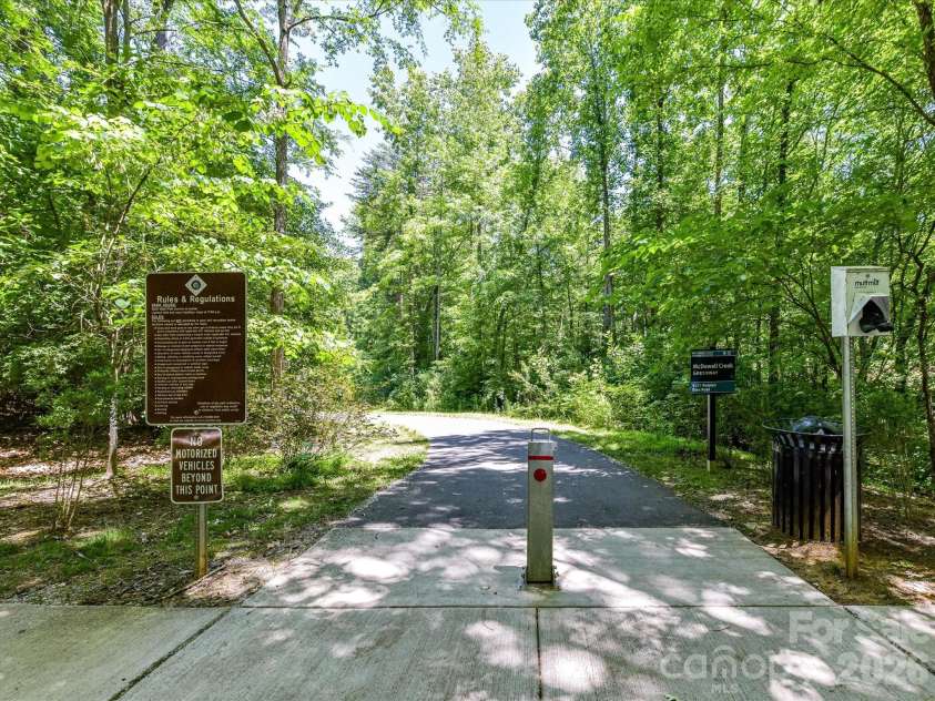 18625 The Commons Boulevard, Cornelius, NC 28031.  MLS# CAR4397710, YatesRealty ID 36310. Direct access to the scenic McDowell Creek Greenway provides miles of paved walking and biking trails surrounded by beautiful natural wooded views.